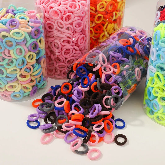 Set van 100 kleurrijke haarbanden voor meisjes - Nylon elastische rubberen bandjes paardenstaarthouders voor kinderen 