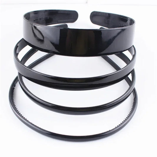Zwarte modieuze golvende unisex haarband van kunststofhars - sportief haaraccessoire 