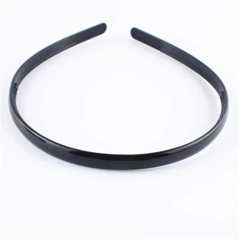 Zwarte modieuze golvende unisex haarband van kunststofhars - sportief haaraccessoire 