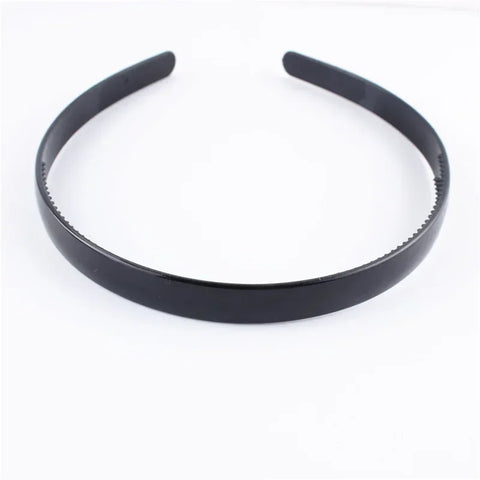 Zwarte modieuze golvende unisex haarband van kunststofhars - sportief haaraccessoire 