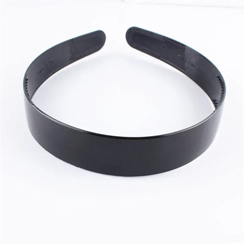 Zwarte modieuze golvende unisex haarband van kunststofhars - sportief haaraccessoire 