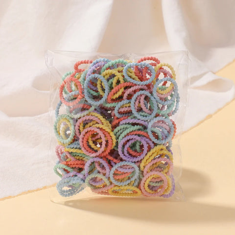 Set van 100 kleurrijke haarbanden voor meisjes - Nylon elastische rubberen bandjes paardenstaarthouders voor kinderen 