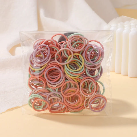 Set van 100 kleurrijke haarbanden voor meisjes - Nylon elastische rubberen bandjes paardenstaarthouders voor kinderen 