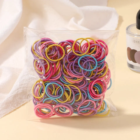 Set van 100 kleurrijke haarbanden voor meisjes - Nylon elastische rubberen bandjes paardenstaarthouders voor kinderen 