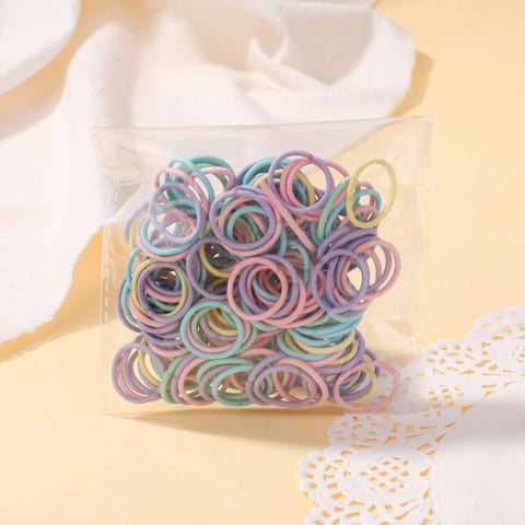 Set van 100 kleurrijke haarbanden voor meisjes - Nylon elastische rubberen bandjes paardenstaarthouders voor kinderen 