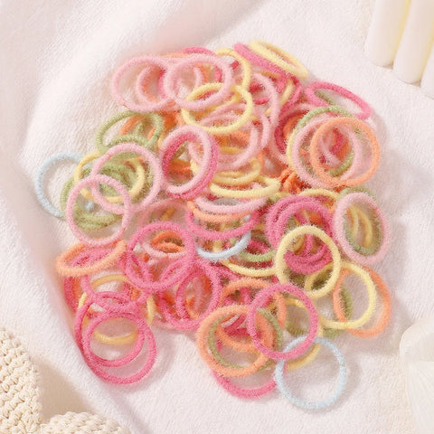 Set van 100 kleurrijke haarbanden voor meisjes - Nylon elastische rubberen bandjes paardenstaarthouders voor kinderen 
